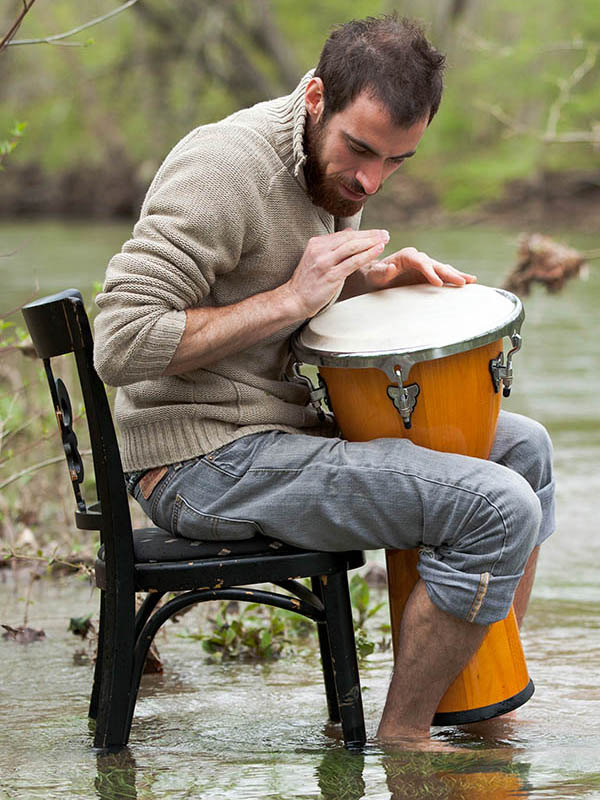 Kenny playing a djembe